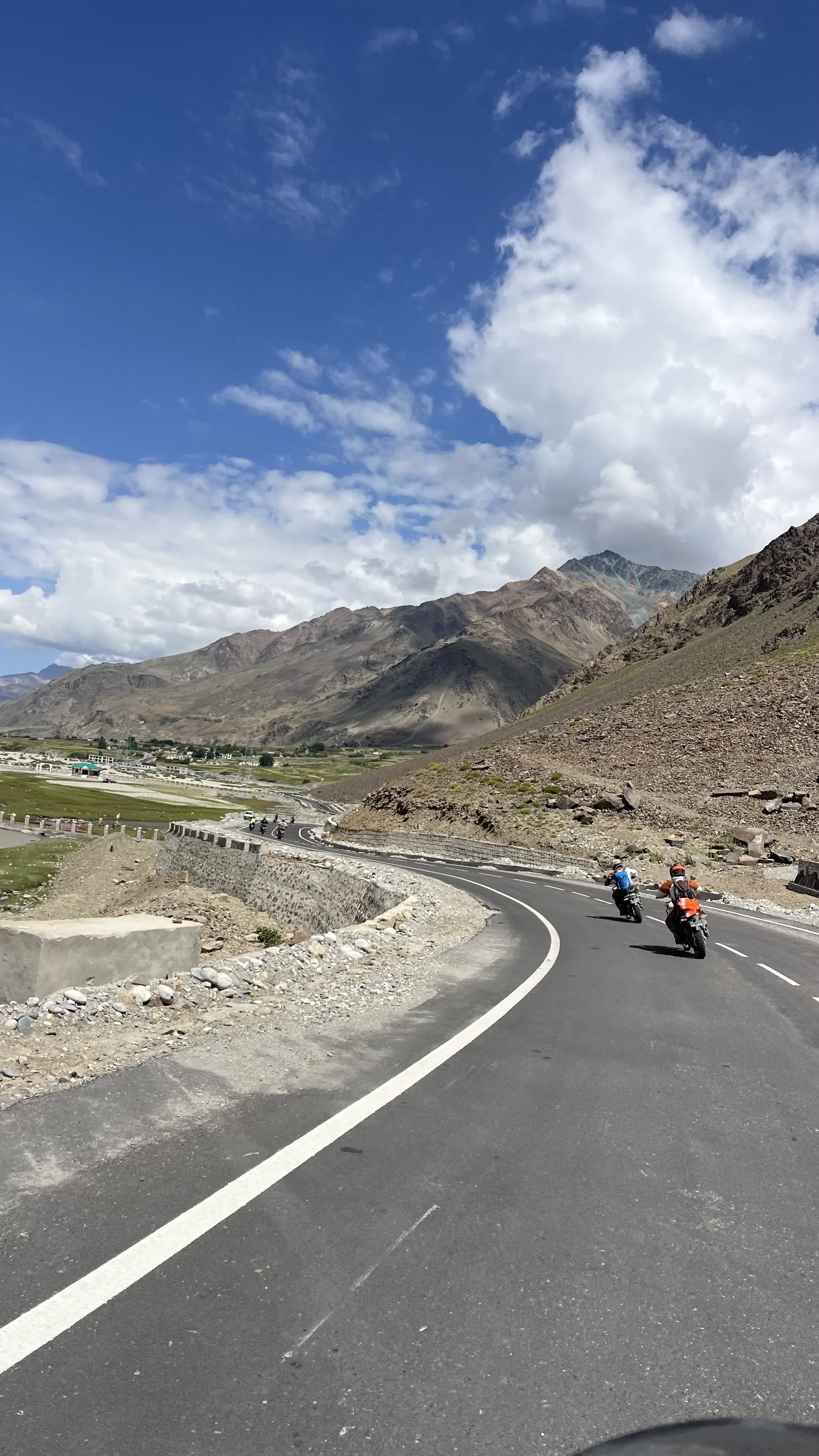 Royal Enfield Himalayan motorcycle at Khardung La Pass summit 17582 feet Ladakh