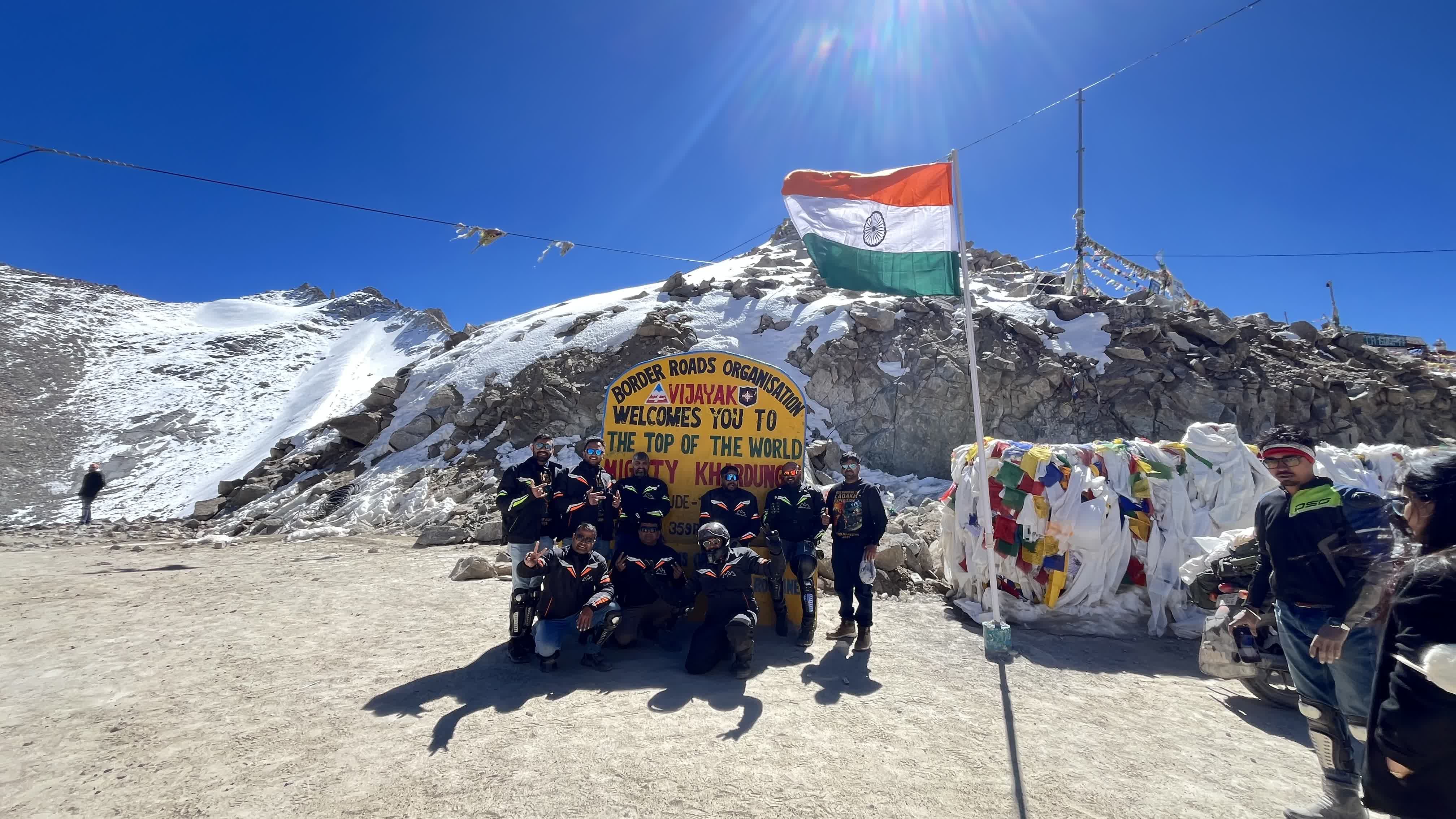 Rider and mechanic doing pre-ride inspection Royal Enfield Leh Ladakh